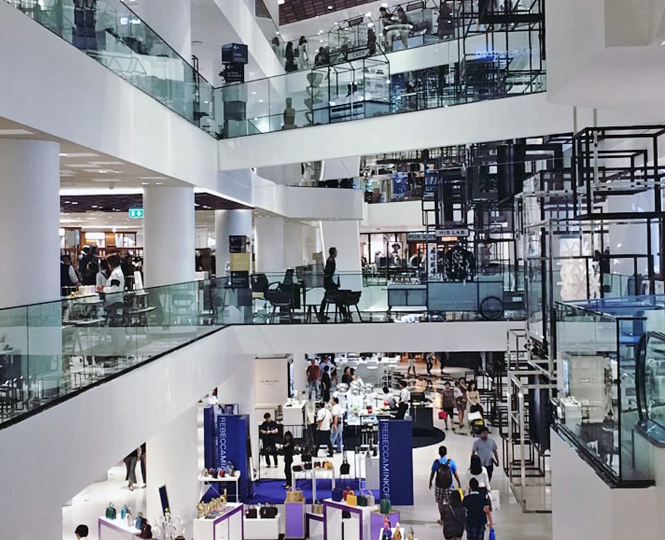 People walk passing through Louis Vuitton Shop at Gaysorn Plaza