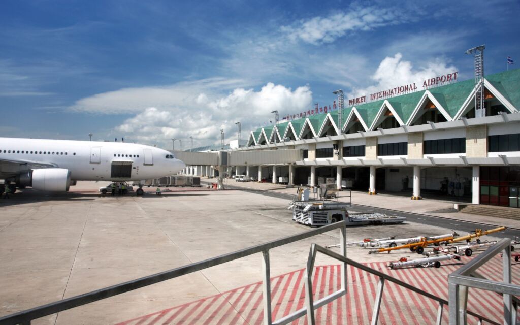 Phuket International Airport exterior view with plane. 