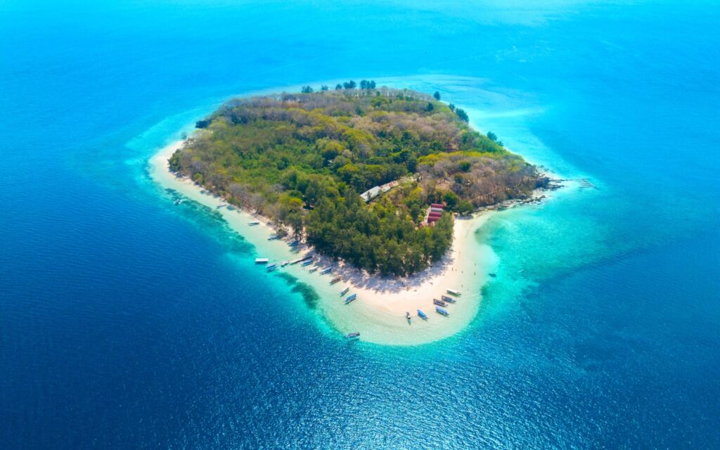 Top view of Gili Nanggu island with white sand and aquamarine water in
Bali, Indonesia.