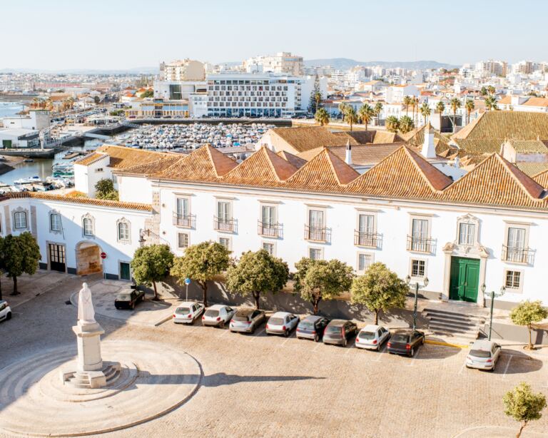 Top cityscape view on the old town with beautiful rooftops in Faro on the south of Portugal