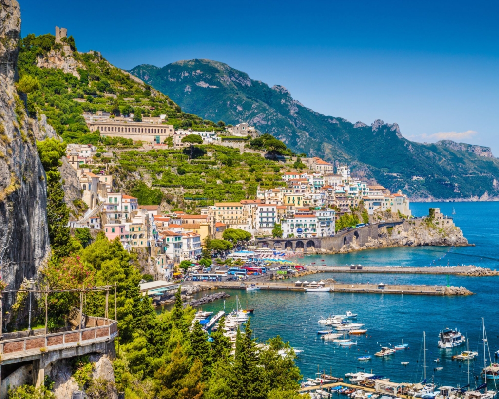 Scenic picture-postcard view of the beautiful town of Amalfi at famous Amalf Coast with Gulf of Salerno, Campania, Italy.