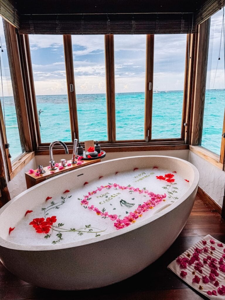 spa bath with rose pedals at Gili Lankanfushi Maldives
