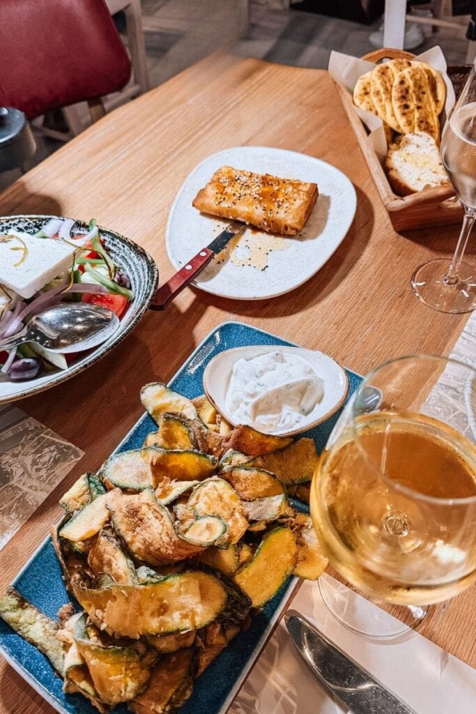 Rooftop bar in Athens offering stunning sunset views and delicious drinks.