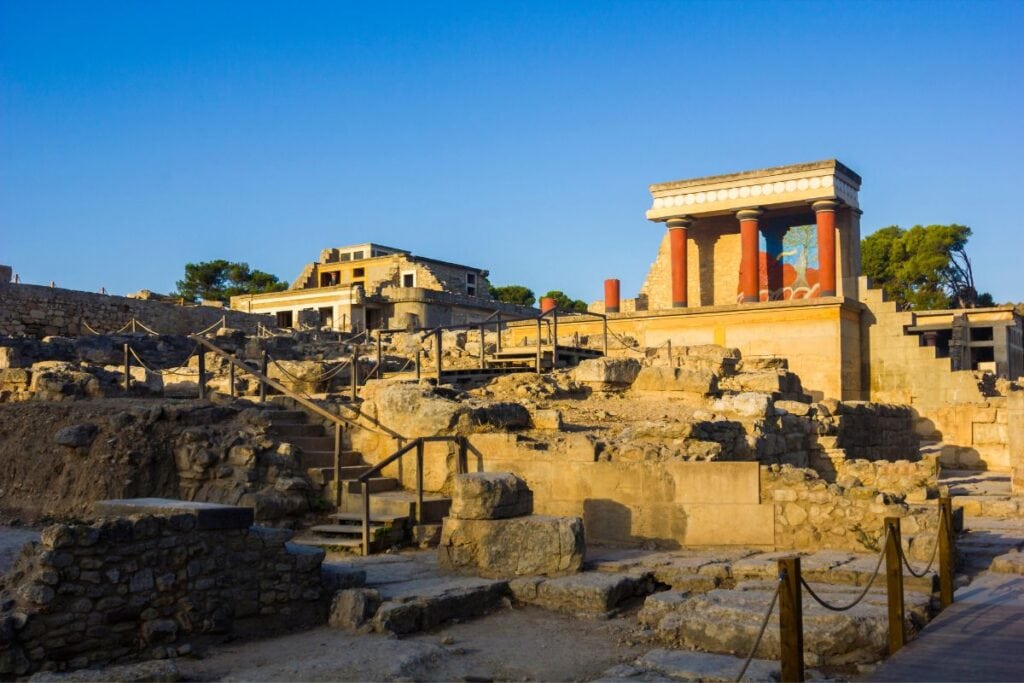 Ancient Greek ruins at sunset with classical architecture and archaeological site.